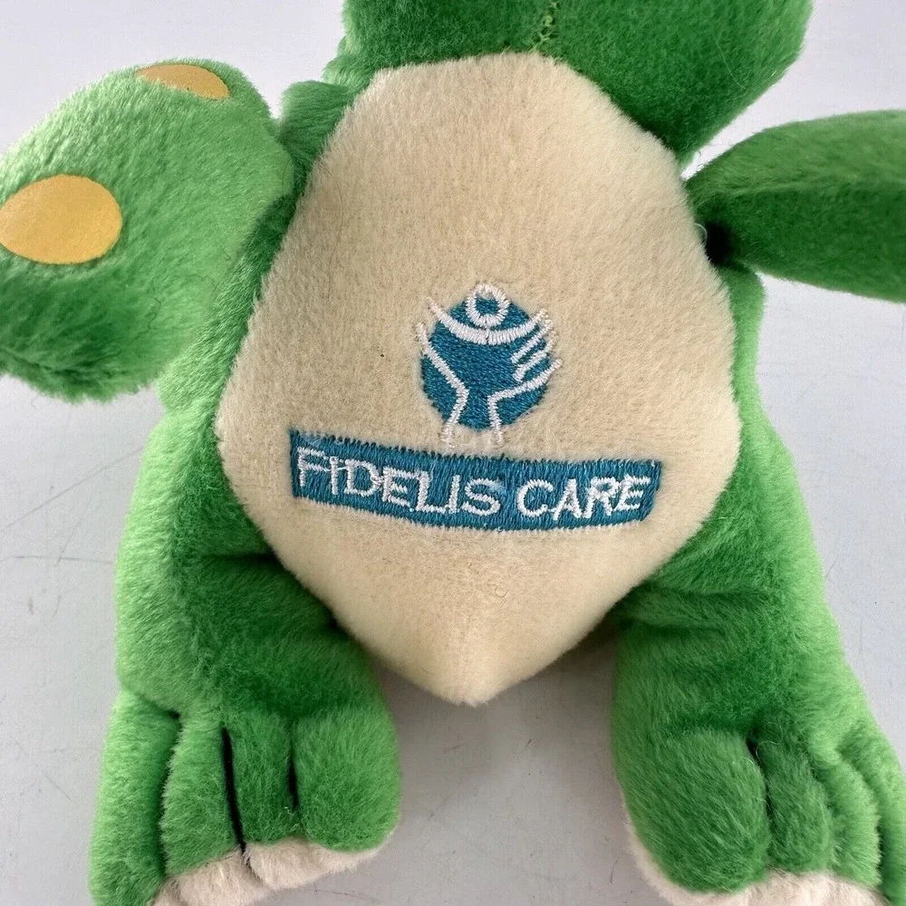 Fidelis Care Green Dinosaur Plush Stuffed Toy With Yellow Horn & Polka Dots 9